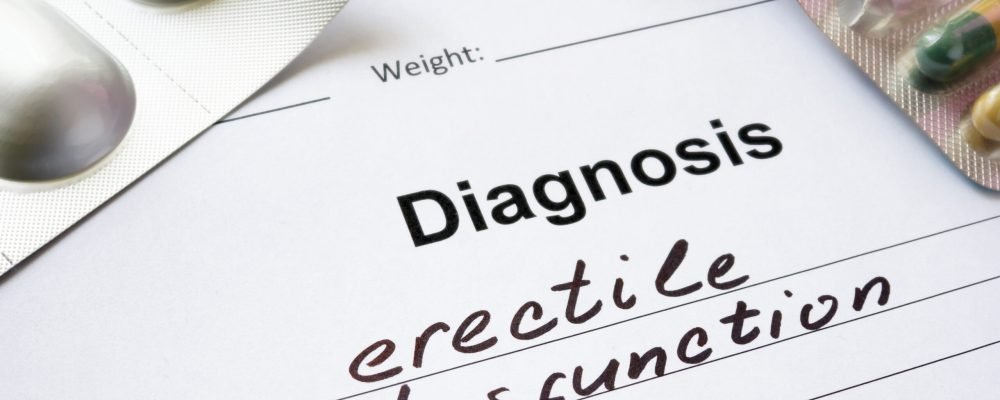 Diagnosis erectile dysfunction written in the diagnostic form and pills.